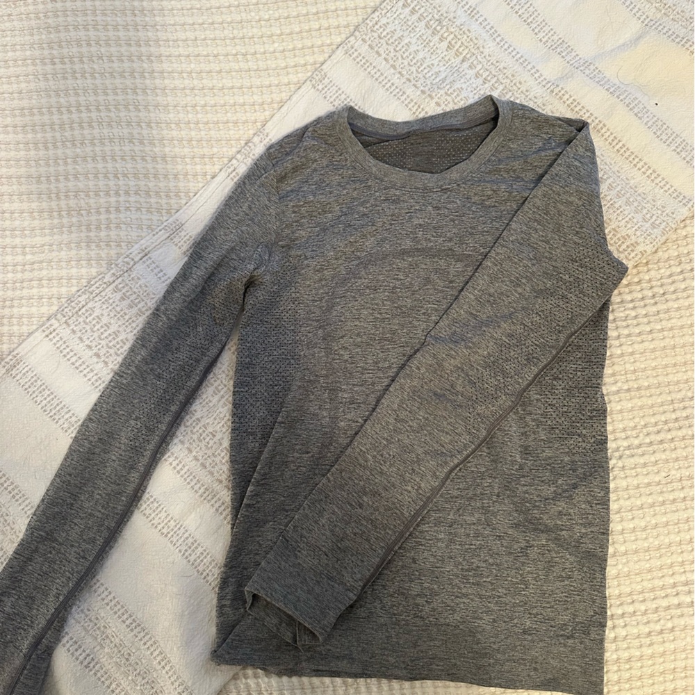 Lululemon long sleeve swiftly. Dark gray, very soft and stretchy.